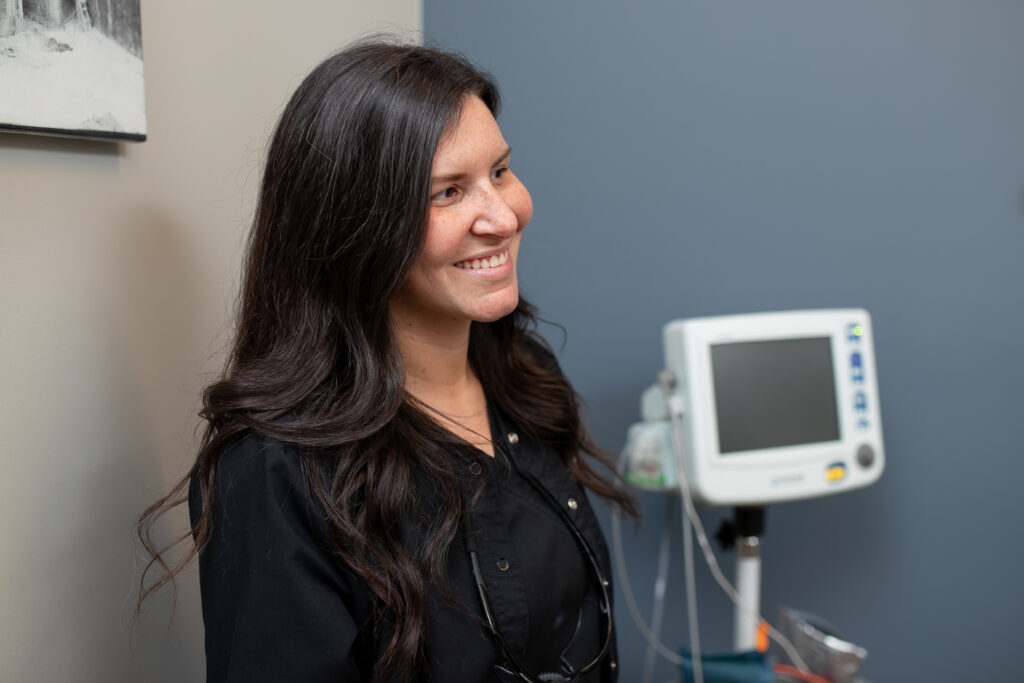 smiling woman at Associated Oral & Implant Surgeons office