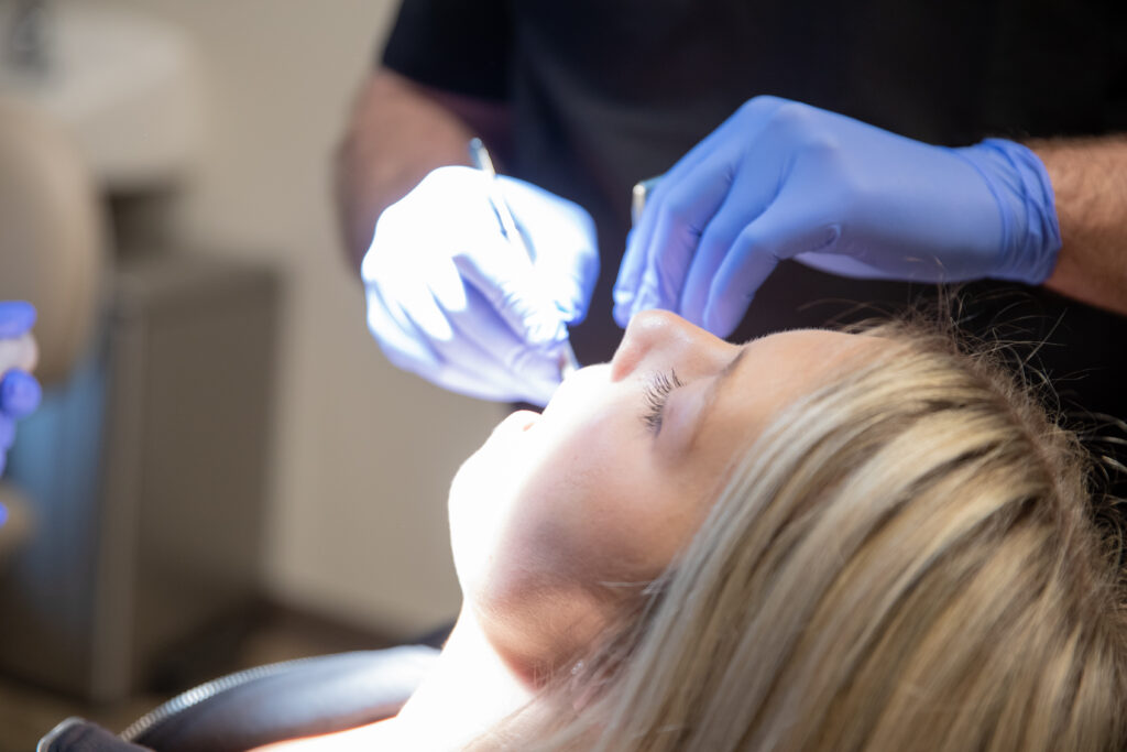 patient receiving dental care from an oral surgeon at Associated Oral & Implant Surgeons