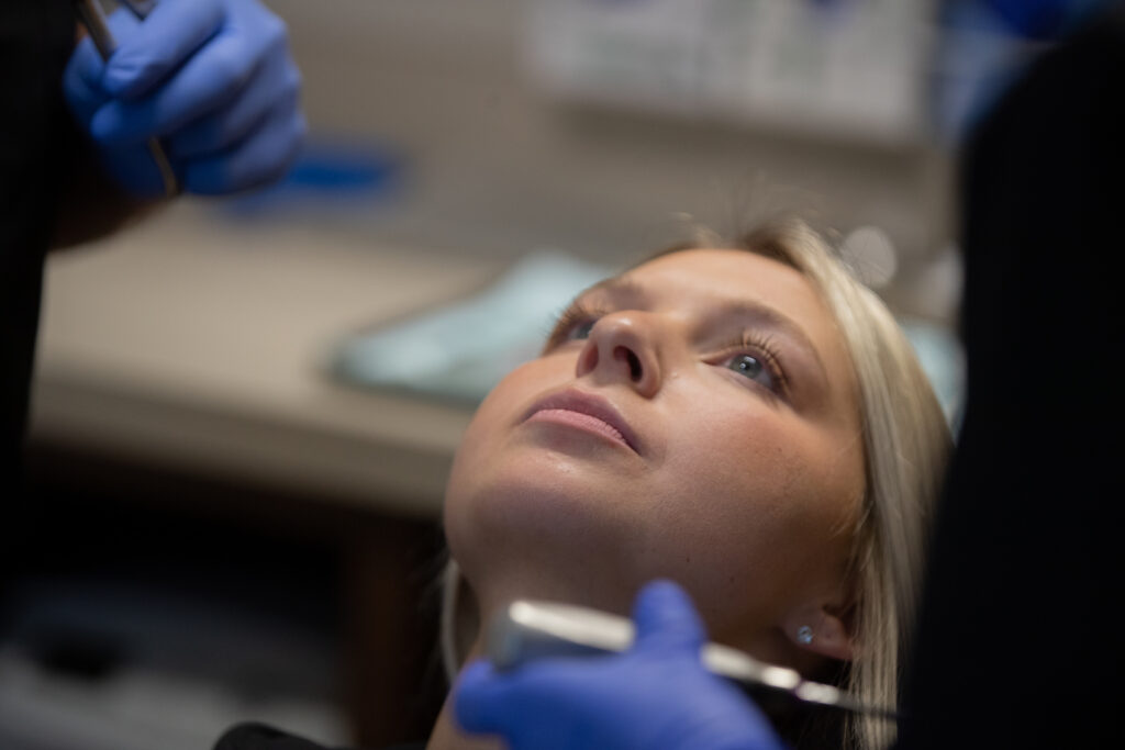 patient discussing pre-operative dental questions with surgeon before an oral procedure at Associated Oral & Implant Surgeons