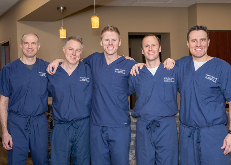 Group picture of five board-certified oral surgeons